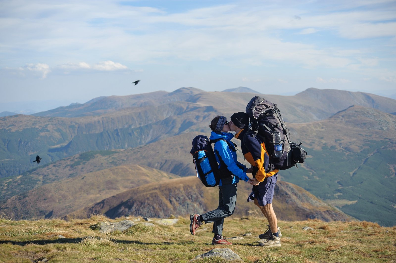 Couple hikers in the Carpathians mountains with Hiking backpacks