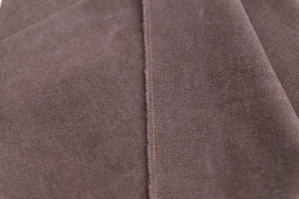Brown textile texture, natural canvas background for custom business backpack