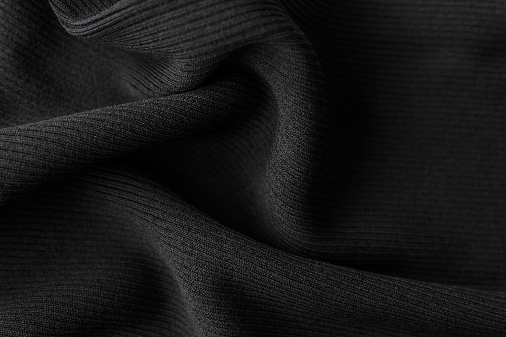Close-up macro texture of textile material or fabric for abstract blank background or wallpaper.