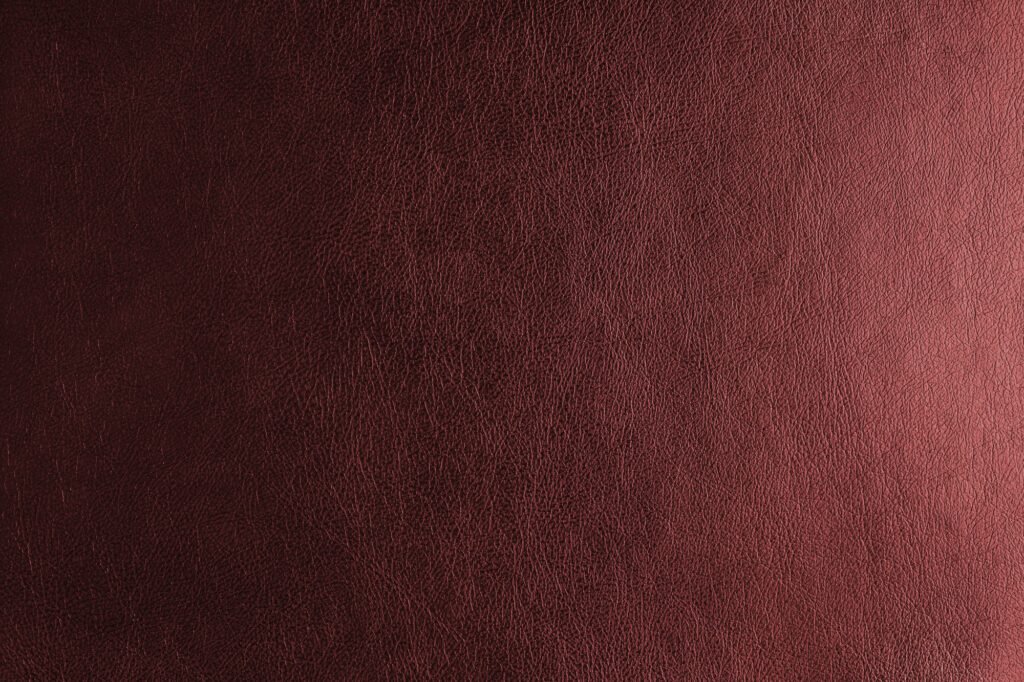 Glossy structure red genuine leather with gradient lighting effect, leatharette texture