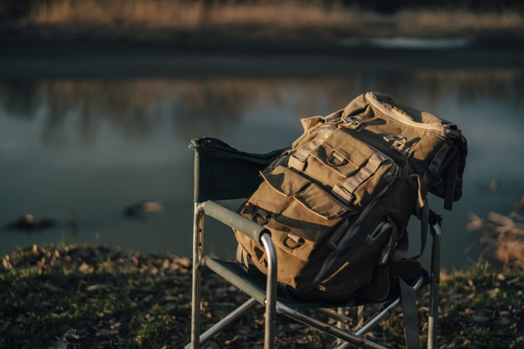 backpacker bag folding chair nature lake travel outdoor