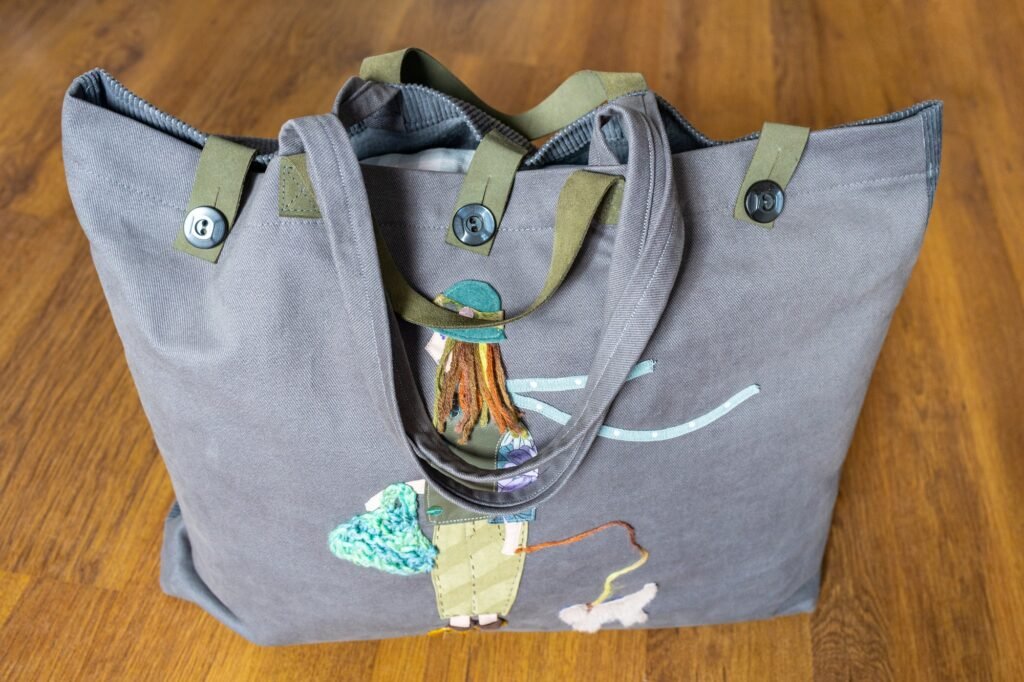 closed handcrafted gray fabric tote bag on floor